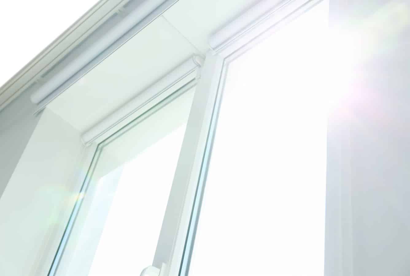 sun gleaming through exceptionally clean all-white windows.