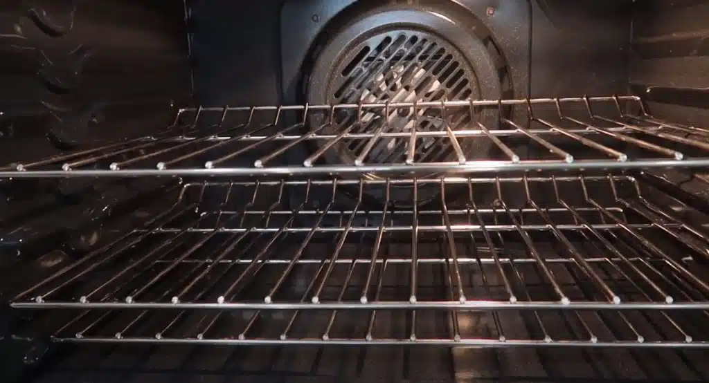 clean oven racks in an oven
