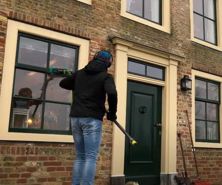 Cleaning exterior windows with a pole window cleaner