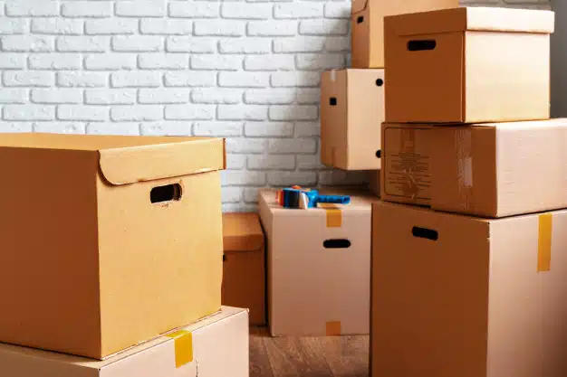 close-up-moving-carton-boxes-empty-room