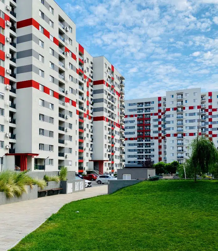 large shared apartment complex with playground in the middle