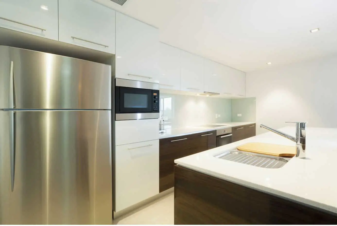 modern kitchen with large stainless steel fridge