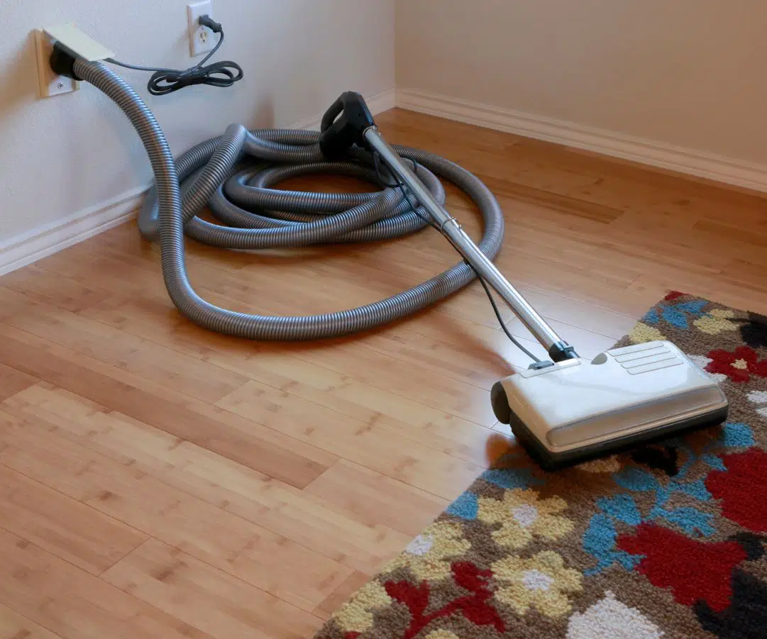 vacuum cleaner on laid down on brown bamboo floor